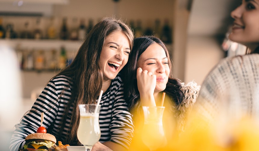 Two young girls laughing, Current account 18-25